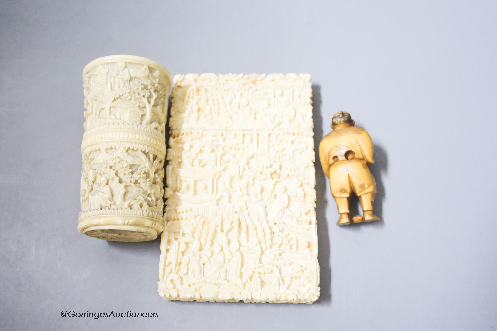 A Canton ivory card case, 11 x 7cm, a dice shaker and a Japanese netsuke